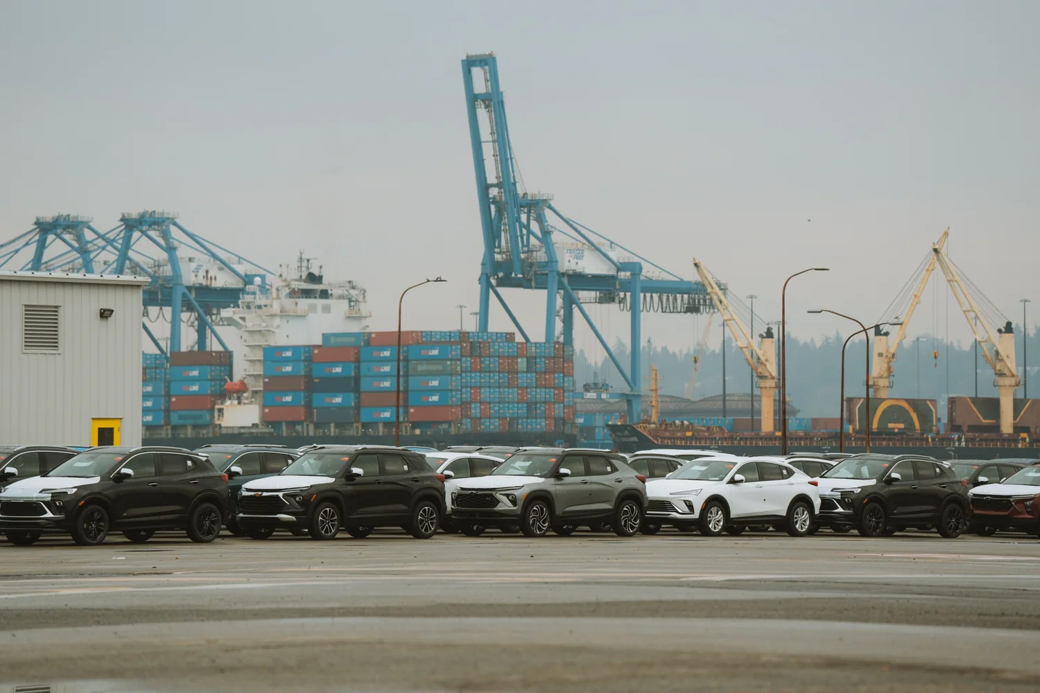 Vehicles waiting at a port terminal before they are shipped out