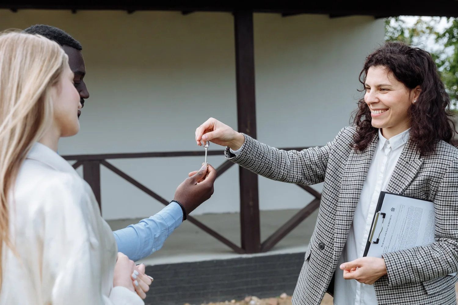 Keys handed to the buyer after a purchase completed through an appointed agent