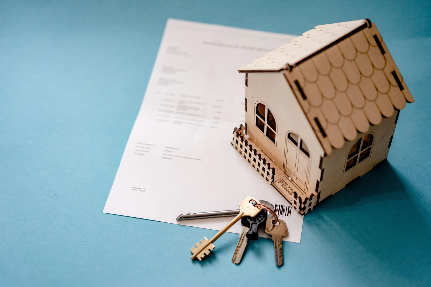 Keys and a purchase document, the end of a property bought through an agent