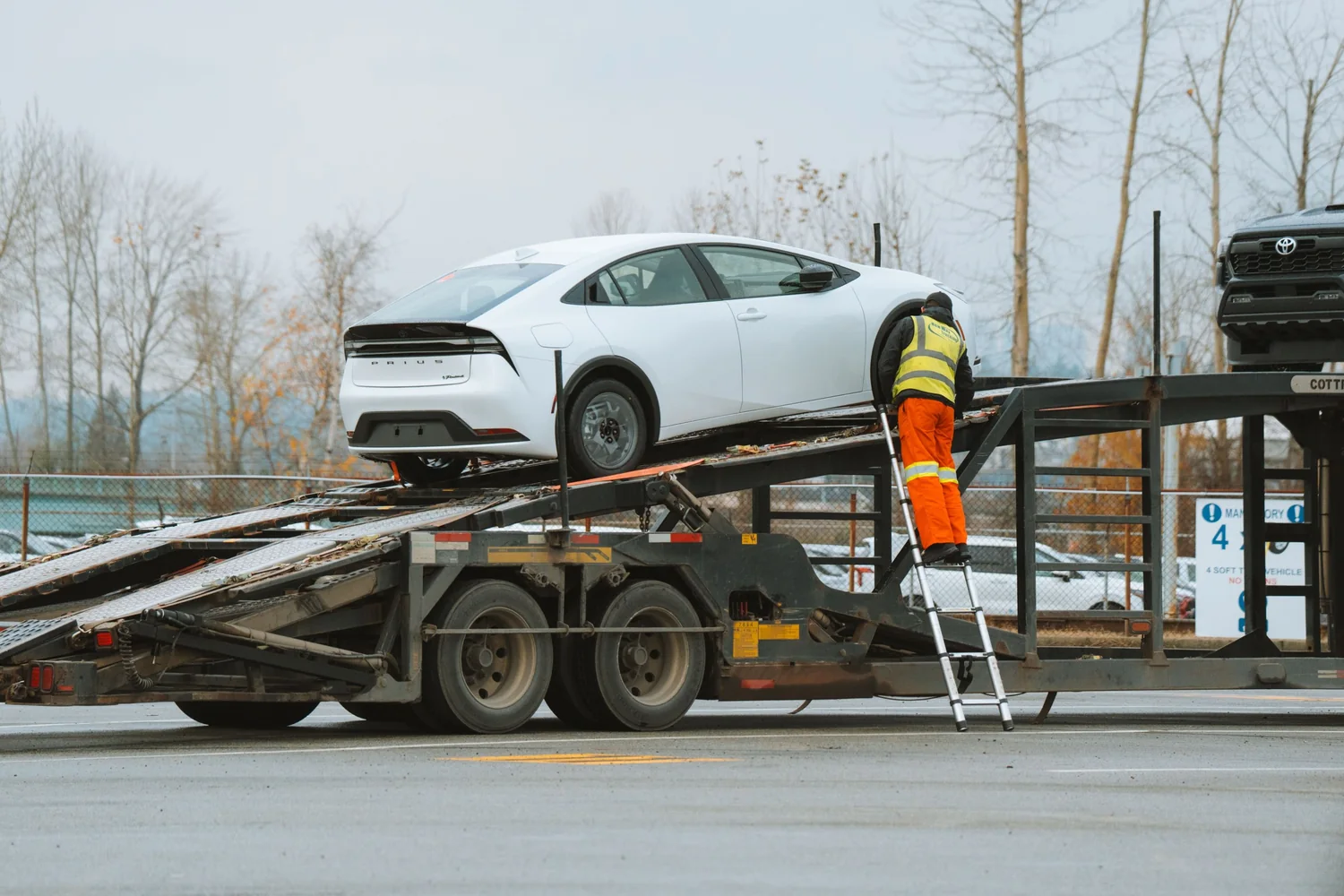 Car loaded onto a transporter by an agent acting for the owner