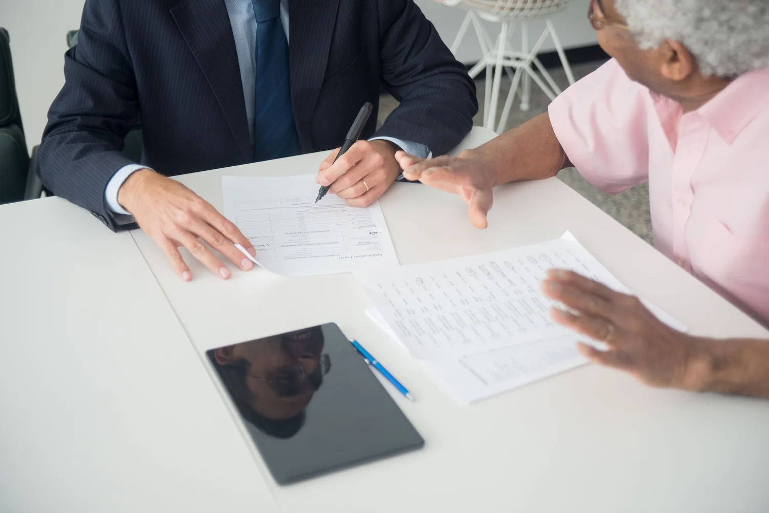 Two parties going through a personal power of attorney before it is signed
